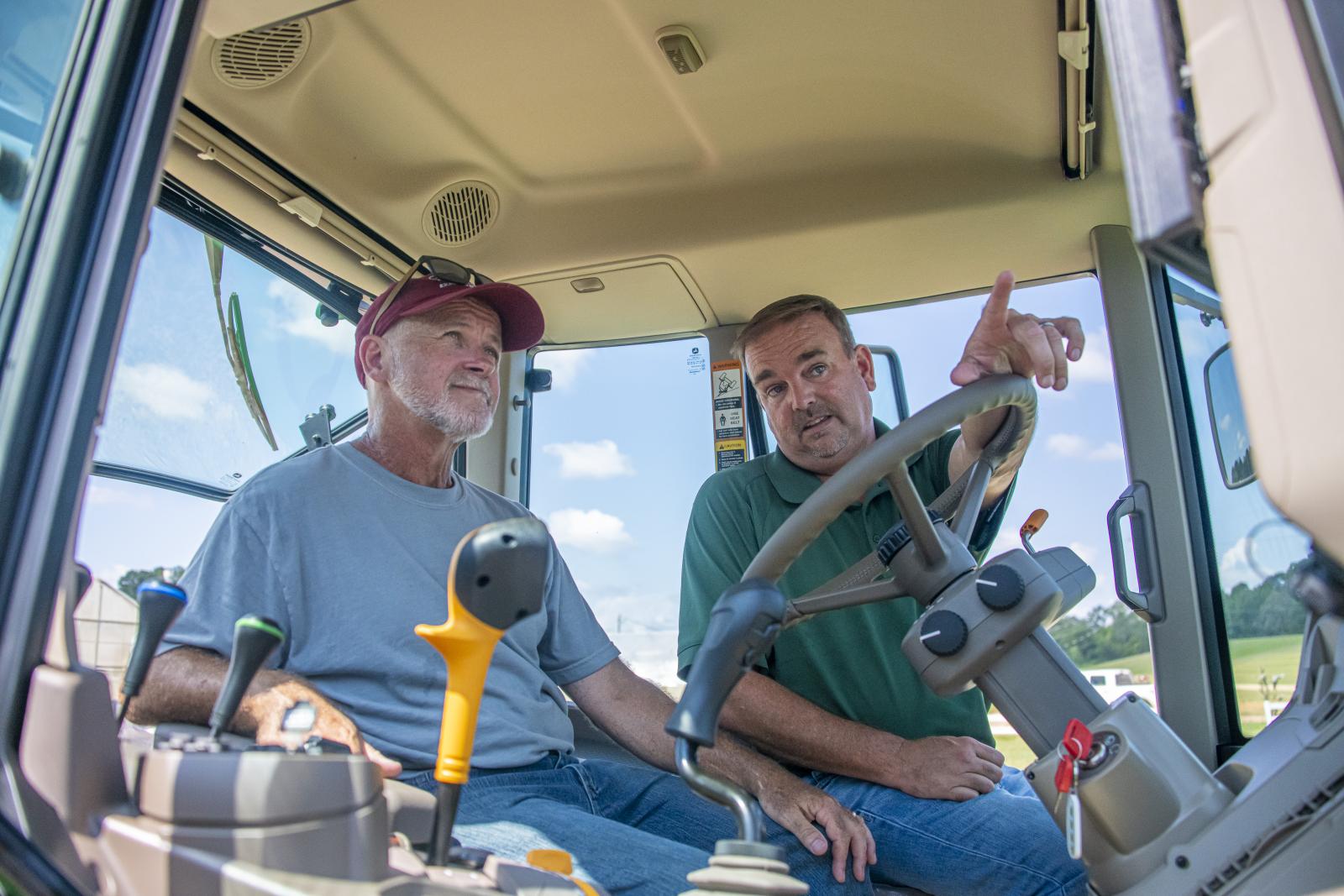 Two men in a tractor