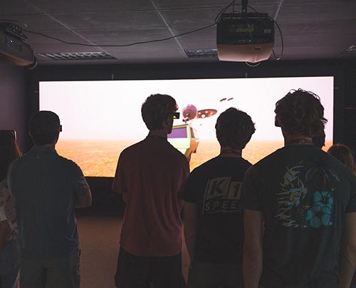 Mississippi State students work in a dark lab.