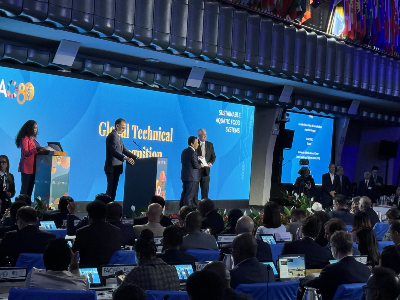 Mississippi State’s Dan Reynolds, associate vice president for international programs, pictured on stage at right and representing the Global Center for Aquatic Health and Food Security, is recognized by U.N. Food and Agriculture Organization Director General Qu Dongyu during the organization’s 80th anniversary celebration Oct. 15.