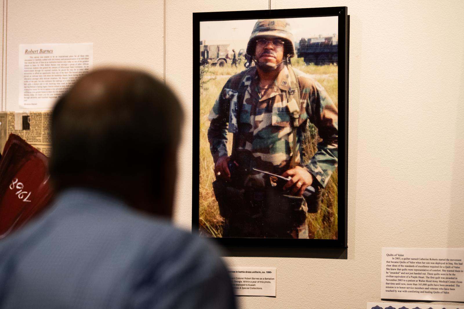 man looking at photograph