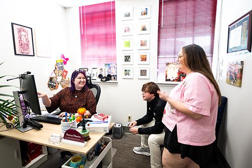 WMSV 91.1 The Junction General Manager Becca Thorn, left, discusses an upcoming episode of “Rise and Ring” with student-hosts Wesley Webb, center, and Gracelyn Johnson.