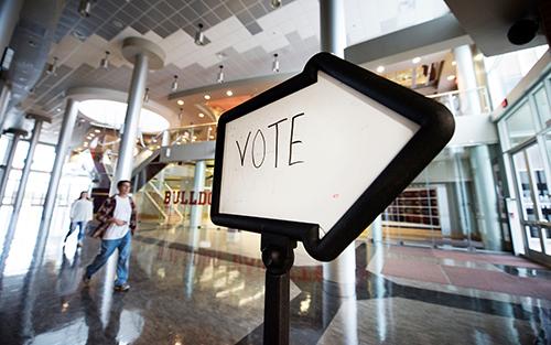 A sign instructs voters where to cast their ballots at Humphrey Coliseum.