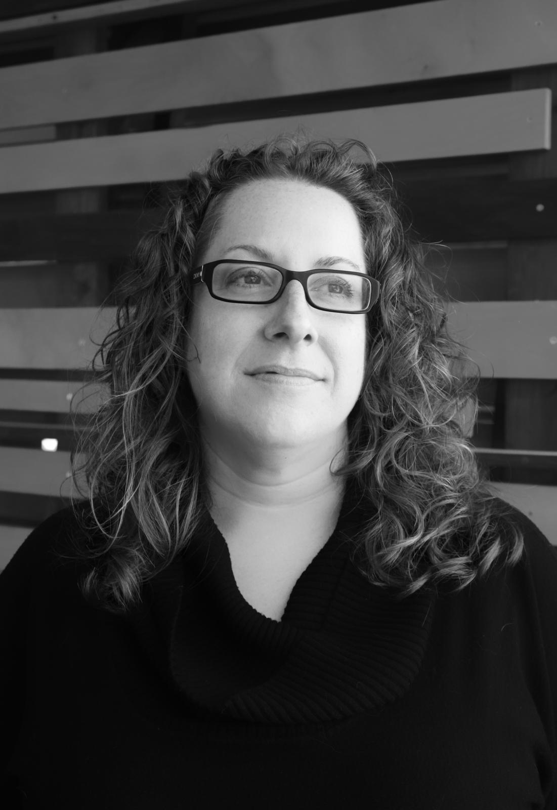 Black and white headshot of Alexis Gregory