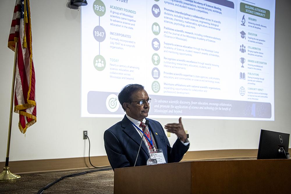 Research professor emeritus Raja Reddy opens the meeting. Reddy is serving his third term as president of the Mississippi Academy of Sciences.