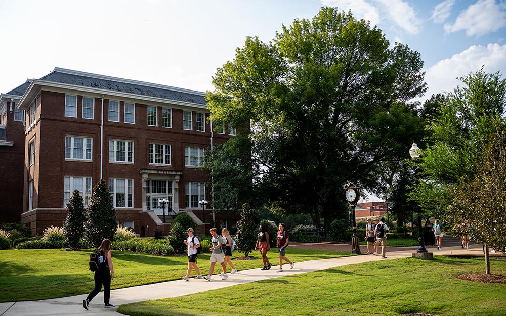 Students walk across the Drill Field on the first day of fall semester in 2025.