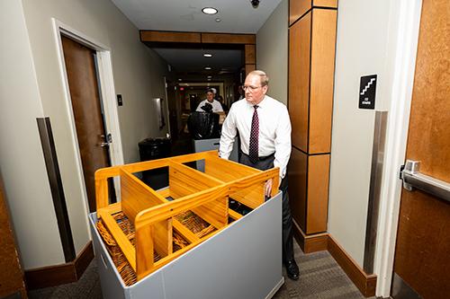 Mississippi State President Mark E. Keenum helps students transport furniture to their rooms during 2025’s MVNU2MSU move-in event.