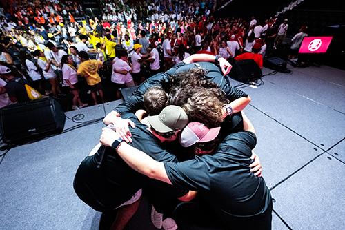 New Maroon Camp participants huddle after a 2025 performance.