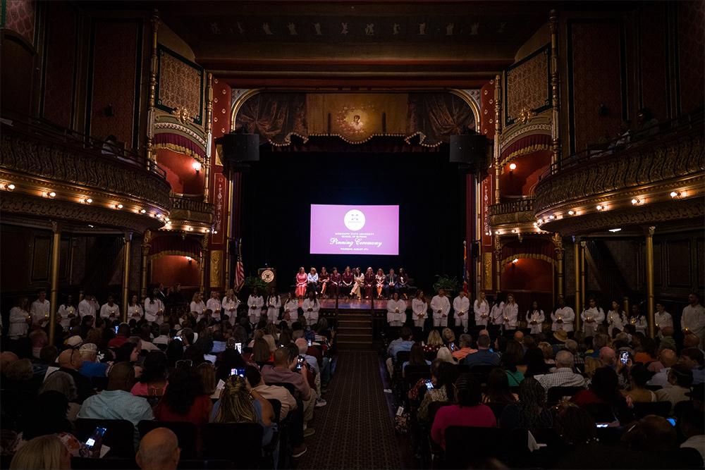 Graduating MSN students are seen during a pinning ceremony at the history MSU Riley Center in downtown Meridian.
